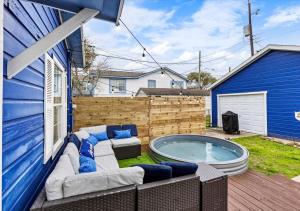 a backyard with a jacuzzi in the yard at The Blue Oasis With Handicap Ramp Access Dog Friendly & Cowboy Pool in Galveston