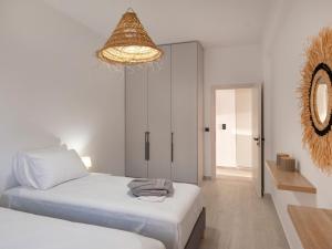 Postel nebo postele na pokoji v ubytování Parosdise Luxury Suites