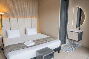 Voodi või voodid majutusasutuse HOTEL NABU VALLEDUPAR toas