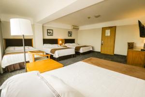 Postel nebo postele na pokoji v ubytování Hotel Miramar
