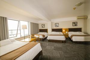 Postel nebo postele na pokoji v ubytování Hotel Miramar
