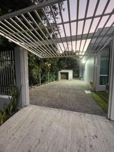 an open door of a building with a glass ceiling at Casa Floratta - Próximo a Unisc in Santa Cruz do Sul