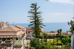 a view from the balcony of a house with a tree at Bellavista in Acireale