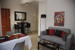 a living room with a couch and a table at NK Dreamy Suite in Thiva +13 photos