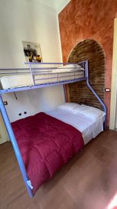 a bedroom with a bunk bed in a room at Bellavista in Acireale +21 photos