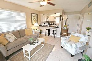 a living room with a couch and a table at Beach Side complex B23 1 Bed 1 Bath w/Heated Pool in Saint Augustine