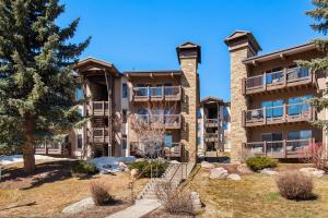 an apartment building with a staircase in front at Woodbridge 34 C in Snowmass Village