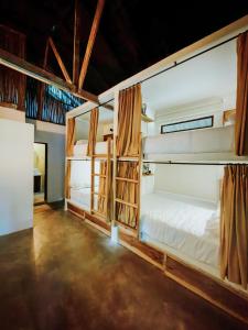 a room with two bunk beds in it at Central Minca in Minca