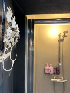 a bathroom door with a towel dispenser on the wall at Watergate YARD in Sleaford