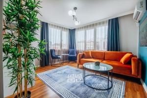 a living room with a couch and a table at Wonder Suites in Istanbul