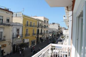 a view of a city street from a balcony at Ilary Rooms 2.0 in Pompei