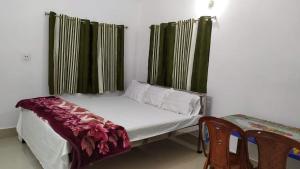 Voodi või voodid majutusasutuse Trinayani Lodge toas