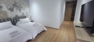 Postel nebo postele na pokoji v ubytování Eden Room SCH