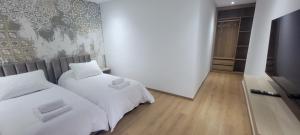 Postel nebo postele na pokoji v ubytování Eden Room SCH
