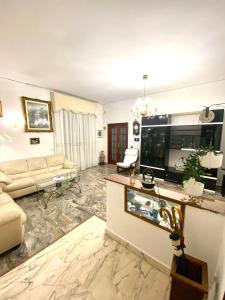 a living room with a couch and a table at Castellano apartment in Naples
