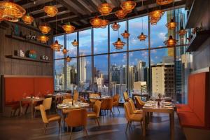 a restaurant with a view of the city at W Panama in Panama City
