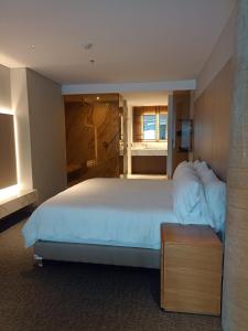 Ένα ή περισσότερα κρεβάτια σε δωμάτιο στο Alko Hotel Integrado +37 φωτογραφίες
