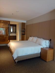 Ένα ή περισσότερα κρεβάτια σε δωμάτιο στο Alko Hotel Integrado