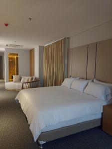 Ένα ή περισσότερα κρεβάτια σε δωμάτιο στο Alko Hotel Integrado