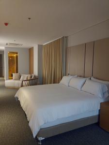 Llit o llits en una habitació de Alko Hotel Integrado