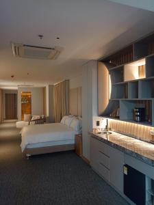 Ένα ή περισσότερα κρεβάτια σε δωμάτιο στο Alko Hotel Integrado