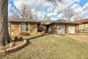 a brick house with a tree in the yard at Family Home 5 Beds 3 Baths By Oc in Edmond