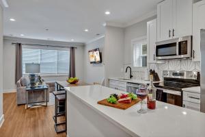 a kitchen with white cabinets and a white counter top at Nashville - 805B Bradford Ave #102 in Nashville