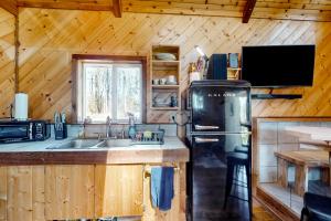 a kitchen with a sink and a stove at Schillinger Fields in Toledo
