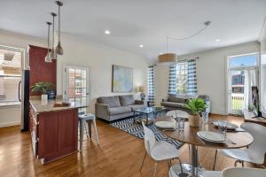 a kitchen and living room with a table and chairs at Nashville - 931 Russell St Apt D in Nashville
