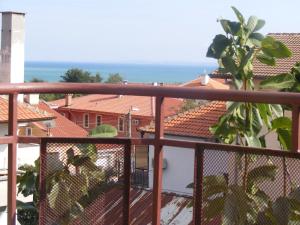 a balcony with a view of the roofs of houses at Guest House "Zora - Sarafovo" in Burgas