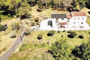 an aerial view of a house with a solar roof at Casa América in Negreira
