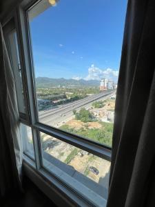 an open window with a view of a highway at Elysium Luxury One Bedroom Apartment Opposite Centaurus Mall Islamabad in Islamabad