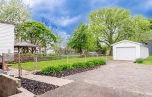 a house with a fence and a driveway at The Richmond - Fair Expo, Derby, YUM in Louisville
