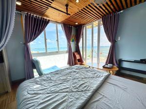 Giường trong phòng chung tại Villa Đại Dương View Biển Đảo Phú Quý
