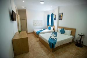 Postel nebo postele na pokoji v ubytování Thanh Thanh Spa & Hotel