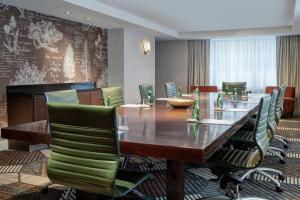 a conference room with a long table and chairs at Hotel Tonnelle New Orleans, a Tribute Portfolio Hotel in New Orleans