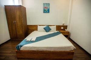 Postel nebo postele na pokoji v ubytování Thanh Thanh Spa & Hotel