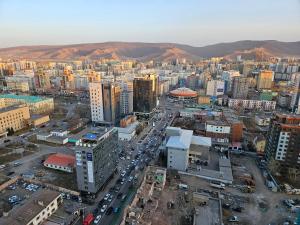 an aerial view of a city with many buildings at Fully furnished apartment fantastic view city center in Ulaanbaatar +4 photos