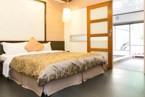 Postel nebo postele na pokoji v ubytování Grand Orchid Resort Villa + 21 fotografií