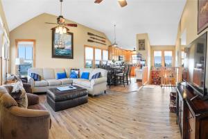 a living room with a couch and a table at 23252 Rodanthe in Nags Head