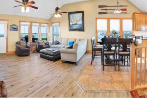 a living room with a couch and a dining room at 23252 Rodanthe in Nags Head
