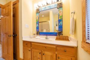 a bathroom with a sink and a mirror at Breathtaking, Perfect, Cozy, "Utterly Awesome" in Nags Head +37 photos