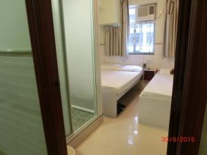 Postelja oz. postelje v sobi nastanitve Li Cheng Guesthouse