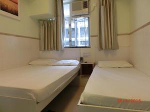 Voodi või voodid majutusasutuse Li Cheng Guesthouse toas
