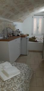 a kitchen with a sink and a counter top at Casa Nave in Monopoli +117 photos