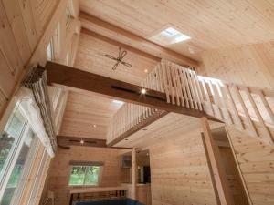 a room with a wooden staircase in a house at lamp yamanaka-山中湖 河口湖 プライベートヴィラ-132平米-最大10名-BBQ無料-乳幼児可-長期滞在設備充実-山中湖車5分-河口湖車20分 in Yamanakako