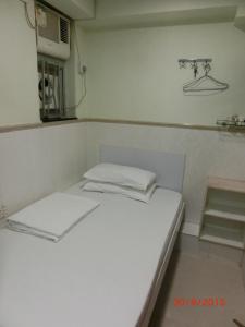 Postelja oz. postelje v sobi nastanitve Li Cheng Guesthouse