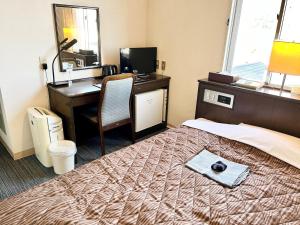 Nakamura Daiichi Hotel客房内的一张或多张床位