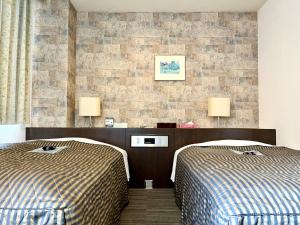 Nakamura Daiichi Hotel客房内的一张或多张床位