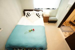 a bedroom with a bed with the word sex on it at Ikebukuro house with 3BR Shinjuku 5min in Tokyo